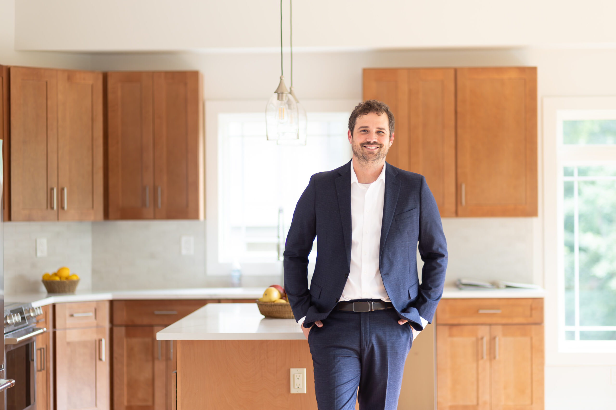 Charles Wilson standing in a home.